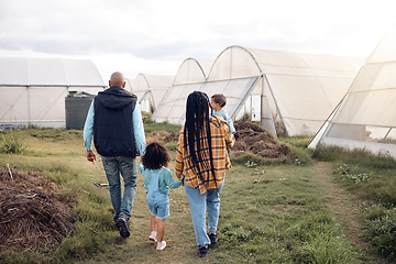 Image showing Farmer family walk, people holding hands on farm and agriculture, mother and father with children back view. Sustainability in countryside, parents and kids farming together outdoor with agro