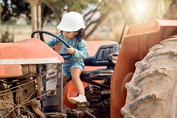 Image showing Girl child in tractor, agriculture and farming transport, sustainability and learning field work with development and fun. Childhood, farm machinery and farmer in training with growth and young kid