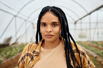 Image showing Black woman, farmer in portrait with agriculture and farming in greenhouse, sustainability with crop harvest. Environment, farm fresh fruit and vegetable produce, green and eco friendly production