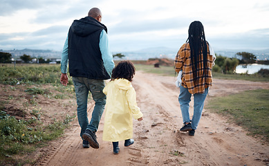 Image showing Agriculture, farm and walking family with girl for quality time, adventure and bonding in countryside. Sustainability, farming and back of mom, dad and child ready for harvest, growth and gardening