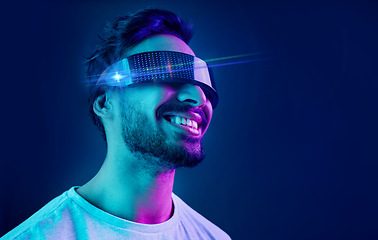 Image showing Vr, glasses or man in metaverse on black background gaming, cyber or scifi on futuristic digital overlay. Smile, virtual reality user or happy fantasy gamer person in a fun 3d experience in studio