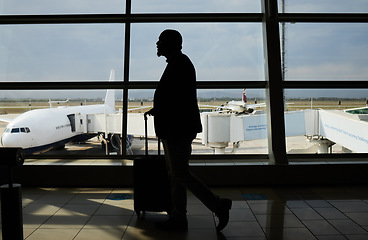 Image showing Airport, travel or silhouette man walking to airplane, flight booking or transportation for world tour. Suitcase luggage, plane departure or profile person on holiday trip, vacation or global journey