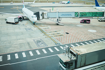 Image showing Stationary airplane at airport, aircraft transport on tarmac and runway for international passenger travel driveway. Plane on ground, outdoor flight terminal and cargo carrier on aeroplane runway