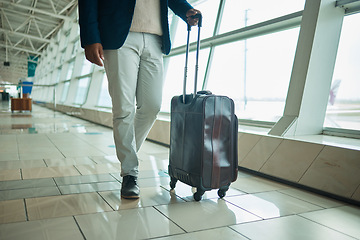 Image showing Airport legs, travel and man walking to airplane, flight booking or transportation for corporate trip. Luggage suitcase, plane departure or African businessman on holiday, vacation or global journey