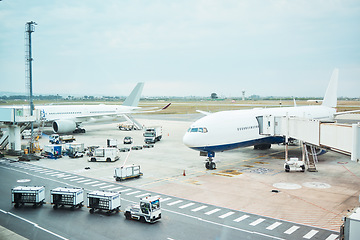 Image showing Airplane at airport, stationary transport on tarmac and runway for international passenger travel on sky horizon. Plane on ground, outdoor flight terminal and cargo carrier on aeroplane runway