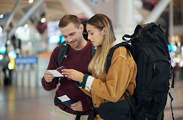 Image showing Couple, airport and checking passport for travel, backpacking or journey excited for vacation together. Happy man and woman looking at ID documents ready for traveling, information or airline trip