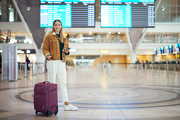 Image showing Woman, airport and luggage for travel, vacation or journey in schedule flight with passport in Cape Town. Portrait of happy female traveler standing ready for departure, boarding plane or immigration