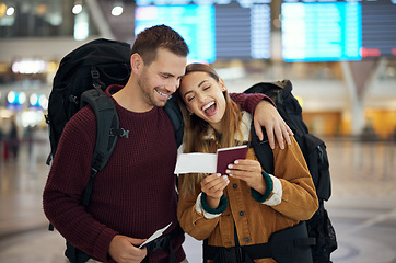 Image showing Ticket, travel and couple at airport with passport talking, chatting or laughing at funny joke. Valentines day, comic and happy man and woman in airline lobby with flight documents and boarding pass.