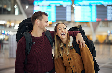 Image showing Travel, hug and couple at airport talking, chatting or laughing at comic or funny joke. Valentines love, thinking and happy man and woman in airline lobby waiting for flight departure for vacation.