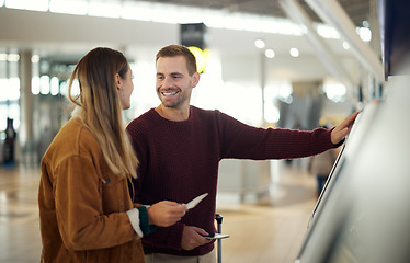 Image showing Airport, travel and couple at check in machine with passport and ticket for flight. Valentines day, immigration or happy man and woman by airline lobby or kiosk with boarding pass and documents.