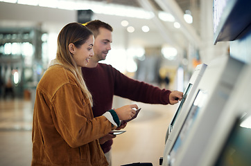 Image showing Travel, airport and couple at check in machine with passport and ticket for flight. Valentines day, immigration or happy man and woman by airline lobby or kiosk for boarding pass for holiday vacation