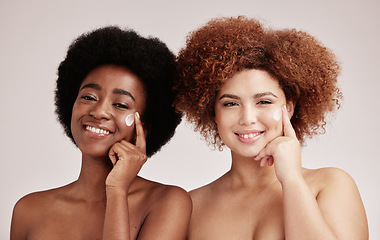 Image showing Cream, face product and girl friends portrait with diversity and happiness for sleepover skincare. Wellness, black women and spa aesthetic with lotion and moisturizer for facial and cosmetic