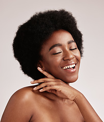 Image showing Beauty, happy black woman and skin glow of a young person face with hands after facial. Wellness, cosmetics and model in a isolated studio with a smile doing dermatology, detox and spa self care