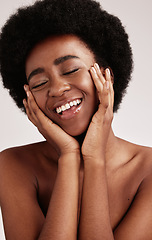 Image showing Beauty, black woman and smile of a young African person face with hands happy about facial. Wellness, cosmetics and model relax in a isolated studio doing dermatology, detox and spa self care