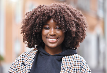 Image showing Happy, smile and portrait of a black woman in the city with optimistic, good and positive mindset. Happiness, excited and face of African female with an afro standing in town while on holiday or trip