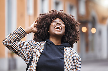 Image showing Black woman, laughing and afro hair in city fun, goofy or silly travel in urban New York or holiday location. Smile, happy or comic student in fashion, trendy or cool clothes with natural hairstyle