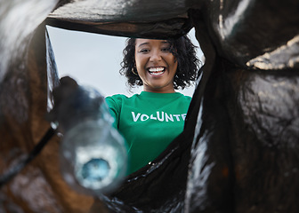 Image showing Recycle, smile and woman with view in bag, sustainability and cleaning plastic pollution for earth day and community service. Saving the environment, charity and people putting trash in garbage.