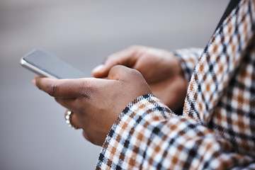 Image showing Closeup, black hands and smartphone for typing, outdoor and connection for social media, chatting and online reading. African woman, zoom and female with cellphone, city and communication with device