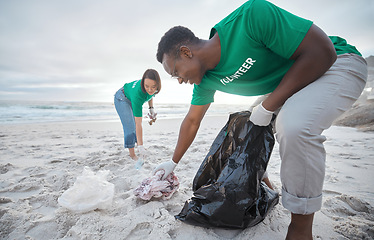 Image showing Friends, cleaning and recycling with people on beach for sustainability, environment and eco friendly. Climate change, earth day and nature with volunteer for community service, pollution and plastic