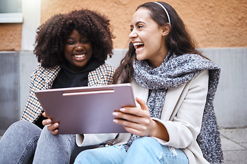 Image showing City women, laughing or bonding on tablet at funny joke, meme or comic internet news on relax urban street. Smile, happy or fashion friends on technology for travel planning or trendy style research