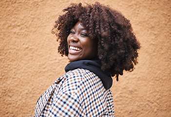 Image showing Black woman, portrait and laughing on wall background in city, urban town or fun in Kenya. Happy young african female smile for happiness, face and curly afro hair with fashion, motivation or freedom