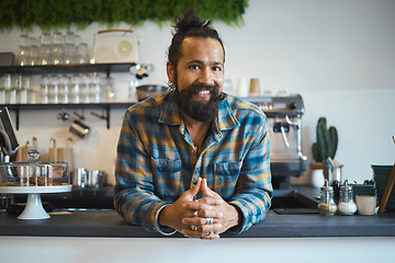 Image showing Indian man, portrait and business owner at coffee shop ready for work with a smile. Happy, cafe and restaurant barista feeling proud of waiter service and boss management at professional job