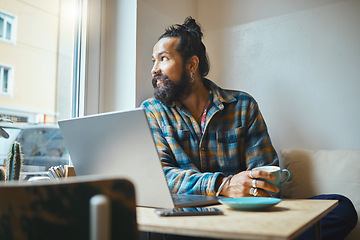 Image showing Laptop, coffee and man in a cafe working on a creative freelance project or small business strategy. Cafeteria, computer and male freelancer doing remote work while drinking a latte in a restaurant.