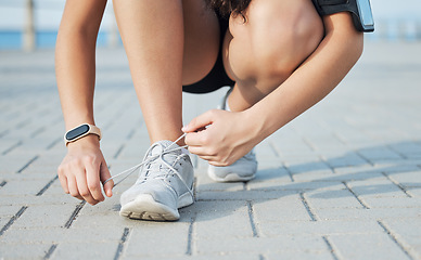 Image showing Shoe lace, fitness and woman outdoor, exercise and training for competition, health and wellness. Ready, female athlete and runner with sneakers, tying laces or workout for practice, energy or cardio