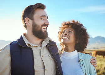 Image showing Love, cow and smile with interracial couple on farm for agriculture, partnership and agro. Teamwork, animals and hug with man and black woman in grass field for sustainability, cattle and environment