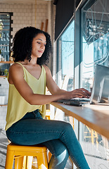 Image showing Black woman, laptop or typing in coffee shop, cafe or restaurant for internet blog, research or startup planning. Thinking, student or freelance creative on remote work technology for small business