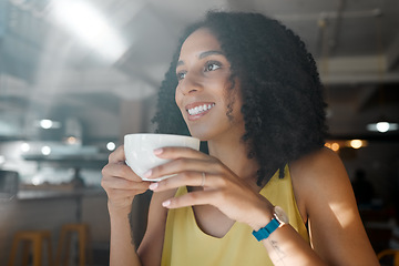Image showing Morning cup of tea, black woman and coffee shop thinking with a young person in a restaurant. Cafe, sitting and happy African female with a hot drink enjoying a day with happiness and an idea