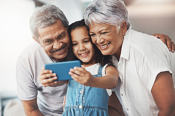 Image showing Love, happy and girl taking selfie with her grandparents for social media in modern family home. Happiness, smile and excited child taking picture with grandmother and grandfather at house in Mexico.