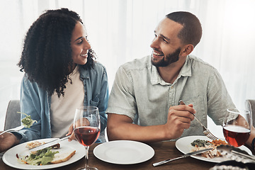 Image showing Happy young couple eating lunch with wine for celebration of love, holiday or valentines with conversation. Mexico people or woman and partner with food at home dining room table on a date together