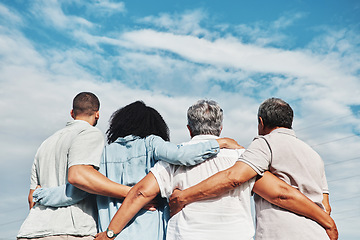 Image showing Family, back and hug with blue sky and grandparents and man together outdoor. Love, care and senior people looking at view in nature feeling happiness and joy from travel for holiday in summer