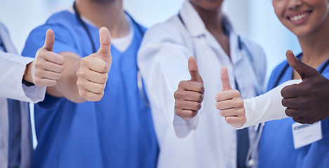 Image showing Healthcare, teamwork and group of doctors with thumbs up, hands together, collaboration and motivation at hospital. Winning, diversity and medical employees in solidarity to help support in medicine.