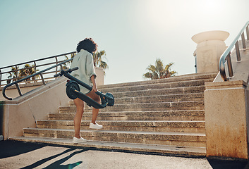 Image showing Walking, scooter and a black woman in the city using eco friendly transport to commute from the back. Street, travel and zero emission with a female aware of her carbon footprint on the environment