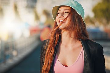 Image showing Travel, happy and mockup with a woman in the city, walking outdoor as a tourist on a summer day. Thinking, freedom and flare with an attractive young female traveler taking a walk for tourism