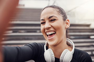 Image showing Woman, face and selfie with headphones and exercise in city, happy in Brazil, laughter and fitness outdoor. Runner, cardio and happiness in picture, health and wellness with active lifestyle