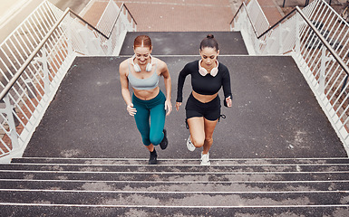 Image showing Fitness, sports or friends running on steps exercise together for healthy lifestyle, wellness or exercising for marathon. Athletes, runners or fast women training in cardio workout on stairs in city