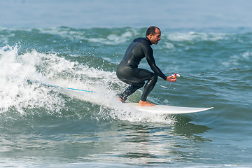 Image showing Surfing the waves