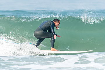 Image showing Surfing the waves