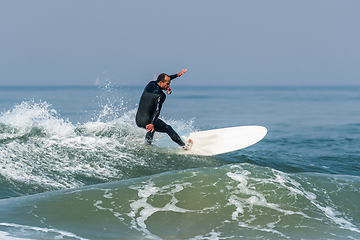 Image showing Surfing the waves