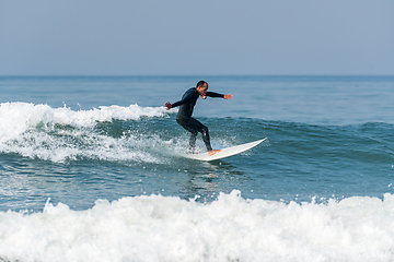 Image showing Surfing the waves