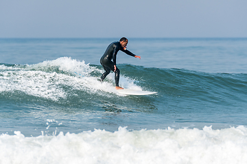 Image showing Surfing the waves