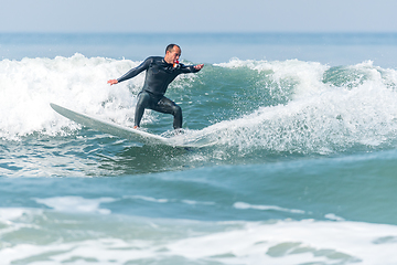 Image showing Surfing the waves