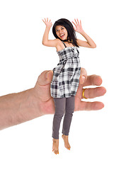 Image showing small woman in large hand