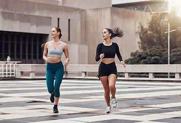 Image showing Fitness, city and friends running together for wellness, energy or outdoor exercise. Sports, healthy women and runner athletes training for cardio workout in urban town with freedom, power and action