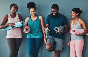 Image showing Fitness, laughing and friends at the gym for training, pilates class and happy for exercise at a club. Smile, sports and man with women in a group for a workout, cardio or yoga on a studio wall