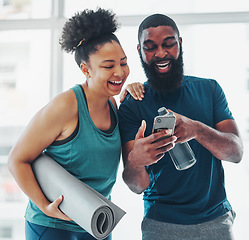 Image showing Phone, meme or yoga friends on social media laughing at funny online content after a fitness class. Pilates, black woman and happy African personal trainer relaxing or enjoying crazy comedy together