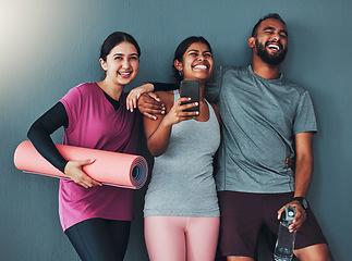 Image showing Fitness friends laugh with phone and diversity, funny meme on social media and exercise together with yoga mat. Comedy online, workout group in gym with healthy lifestyle, wellness and happy people